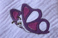 Nuschi mit Stickmuster Schmetterling, 60x60 cm, reine Bio-Baumwolle